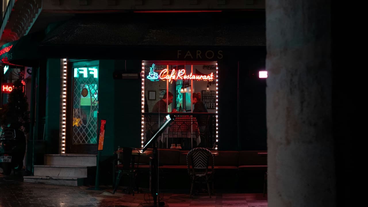 Couple enjoys a night out at a charming café restaurant in Istanbul, Turkey.